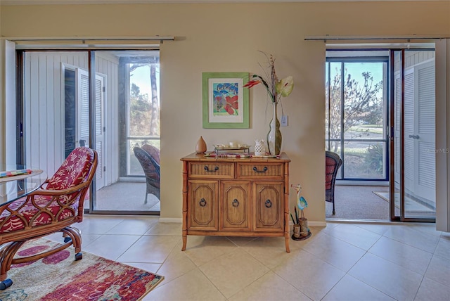 interior space with a healthy amount of sunlight and light tile patterned floors