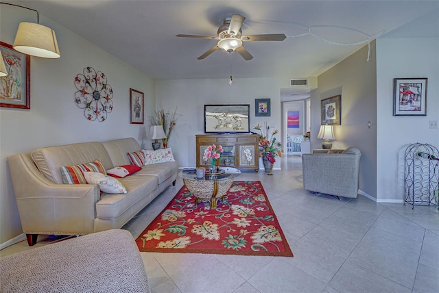 living room featuring ceiling fan and light tile patterned floors