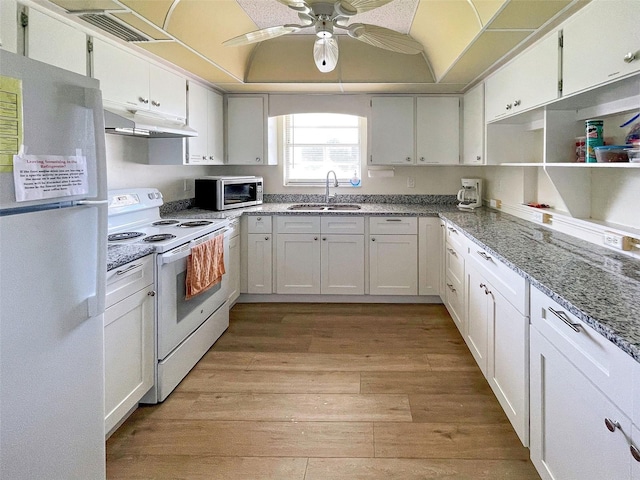 kitchen with sink, white cabinetry, and white appliances