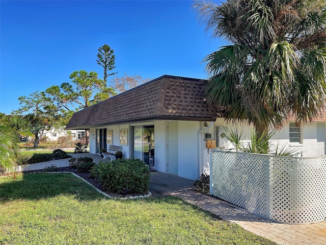 view of front of house featuring a front lawn and a porch