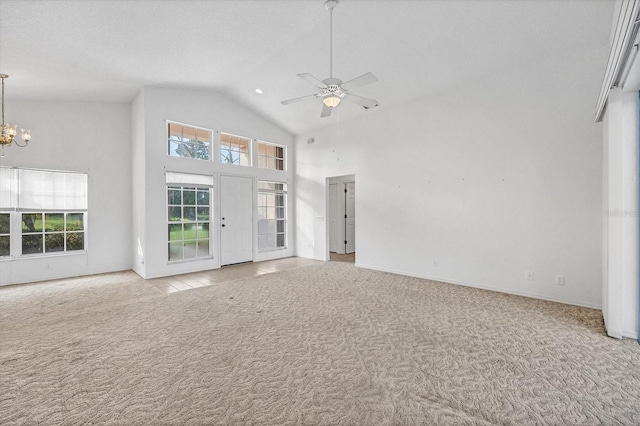 unfurnished living room featuring light carpet, high vaulted ceiling, and ceiling fan with notable chandelier