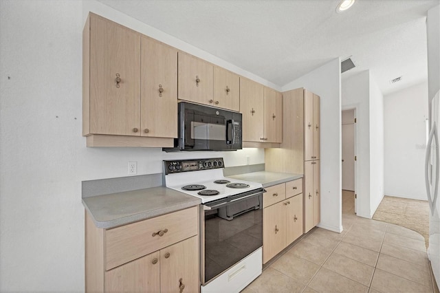 kitchen with light tile patterned flooring, light brown cabinets, and white electric range oven