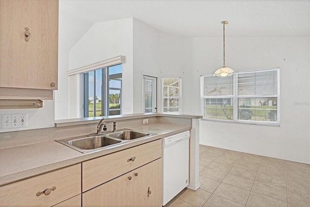 kitchen featuring sink, white dishwasher, hanging light fixtures, vaulted ceiling, and light brown cabinets