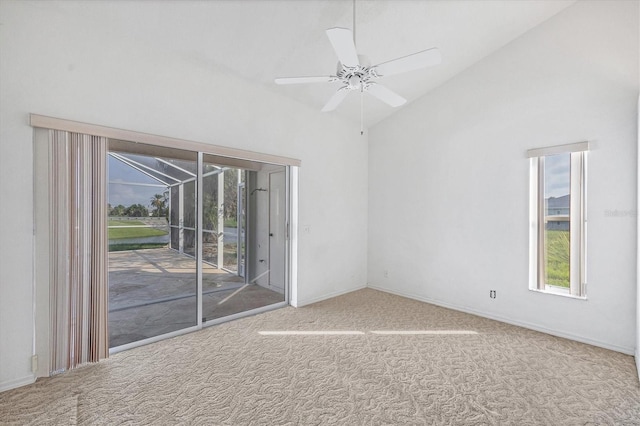 carpeted empty room featuring lofted ceiling and ceiling fan