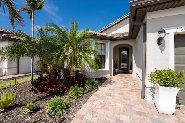 13077 Rinella St, Venice, FL 34293 - entrance to property with stucco siding