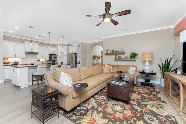 living room featuring light hardwood / wood-style floors, crown molding, and ceiling fan