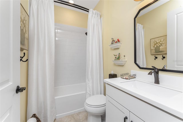 full bathroom with toilet, shower / bath combo with shower curtain, vanity, and tile patterned flooring