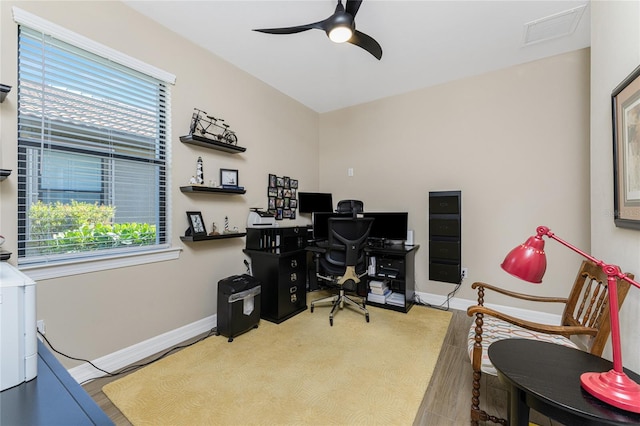 office space featuring ceiling fan and light hardwood / wood-style flooring