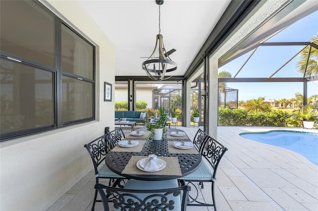 sunroom / solarium with a notable chandelier