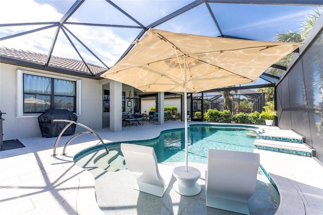 view of pool with a patio area, area for grilling, and a lanai