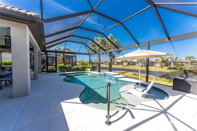 view of swimming pool featuring a patio area and glass enclosure