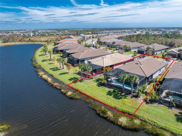 birds eye view of property with a water view