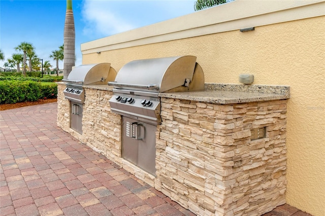 view of patio / terrace with an outdoor kitchen and grilling area