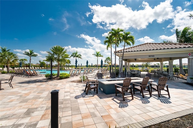 view of patio / terrace featuring a gazebo and a community pool