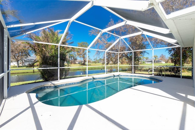 view of swimming pool featuring a patio, a water view, and glass enclosure