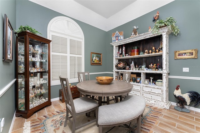 dining space with wood-type flooring