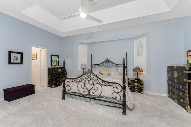 bedroom with ceiling fan, a textured ceiling, and carpet floors