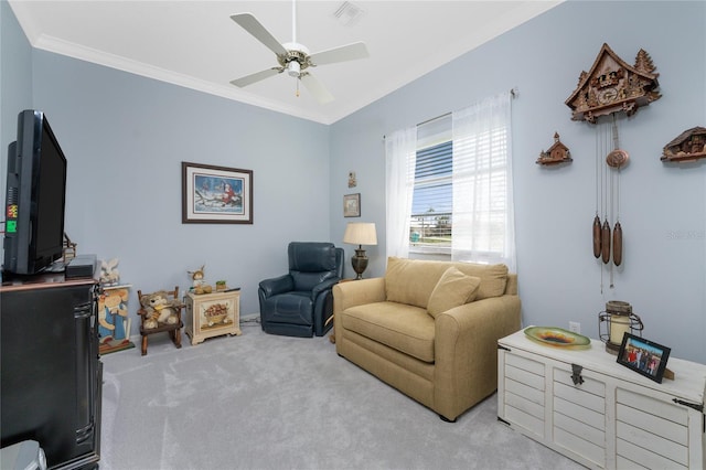 sitting room featuring ceiling fan, light carpet, and ornamental molding