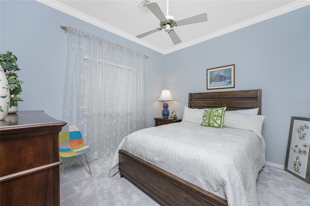 bedroom featuring ornamental molding, light colored carpet, and ceiling fan