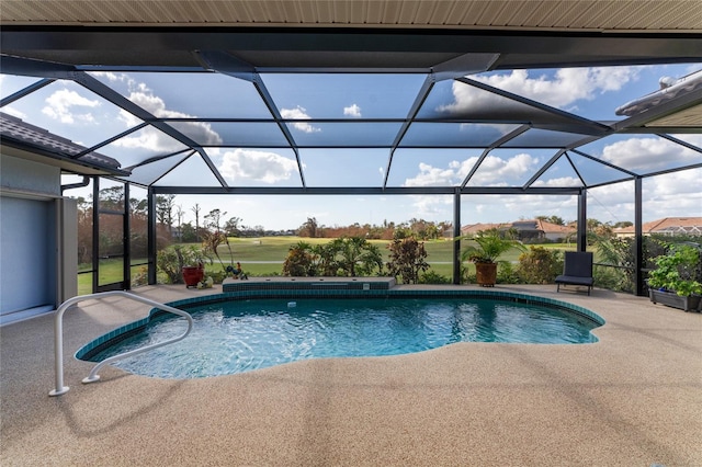 view of swimming pool featuring a patio and a lanai