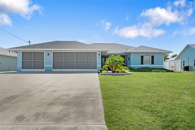 ranch-style house with a front yard and a garage