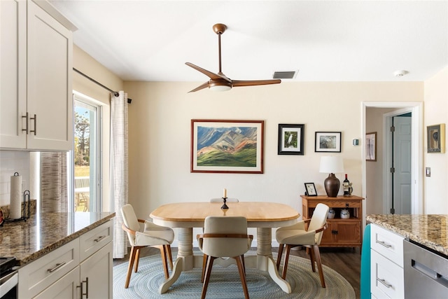 dining room with dark wood-type flooring and ceiling fan