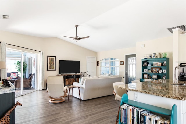 living room featuring sink, ceiling fan, vaulted ceiling, and dark hardwood / wood-style flooring