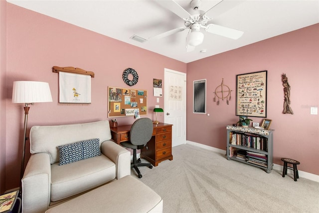 office with light colored carpet and ceiling fan