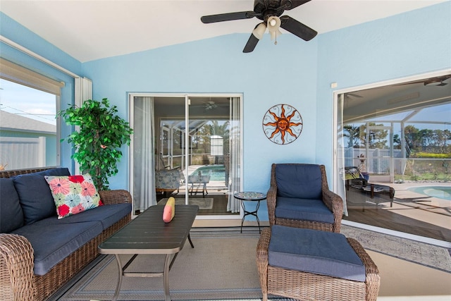 view of patio with glass enclosure and ceiling fan