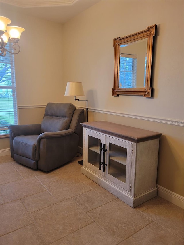 living area featuring a chandelier and light tile patterned floors