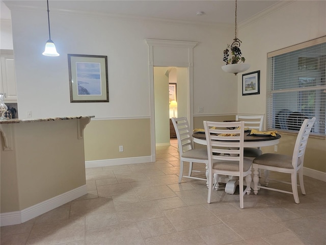 dining area featuring ornamental molding