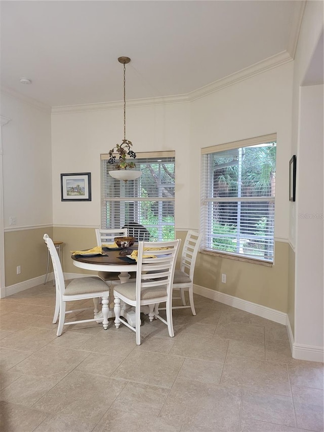 dining area featuring light tile patterned flooring and ornamental molding