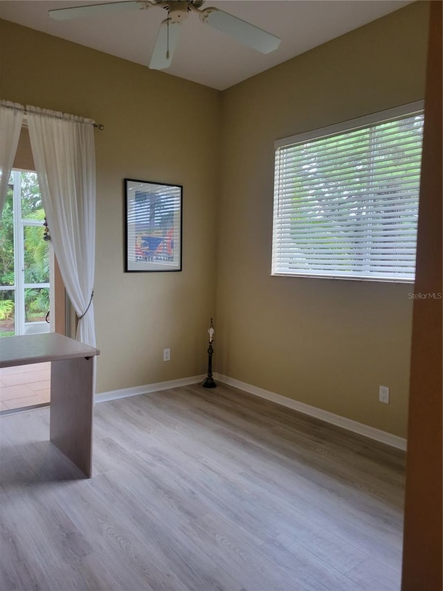 unfurnished room featuring ceiling fan and light hardwood / wood-style flooring