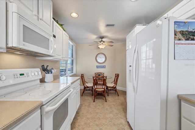 kitchen featuring white cabinets, ceiling fan, white appliances, and light tile patterned floors