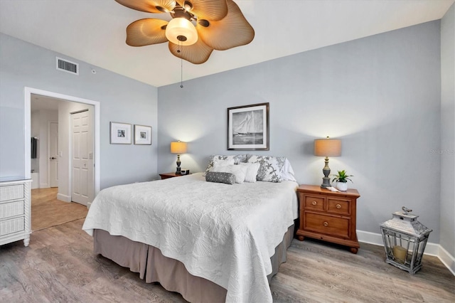 bedroom with hardwood / wood-style floors and ceiling fan