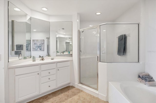 bathroom featuring tile patterned floors, vanity, and shower with separate bathtub