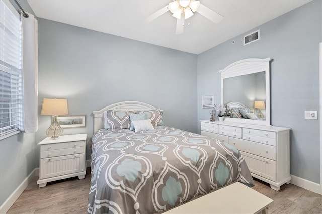 bedroom featuring hardwood / wood-style floors and ceiling fan