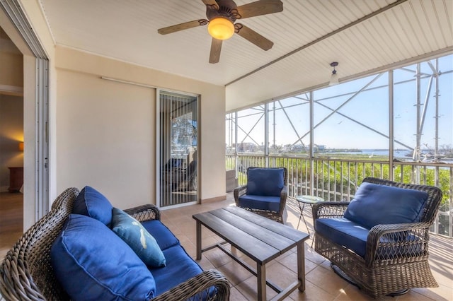 sunroom / solarium with ceiling fan and a healthy amount of sunlight