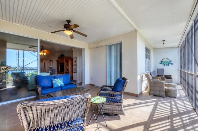 view of patio with outdoor lounge area and ceiling fan