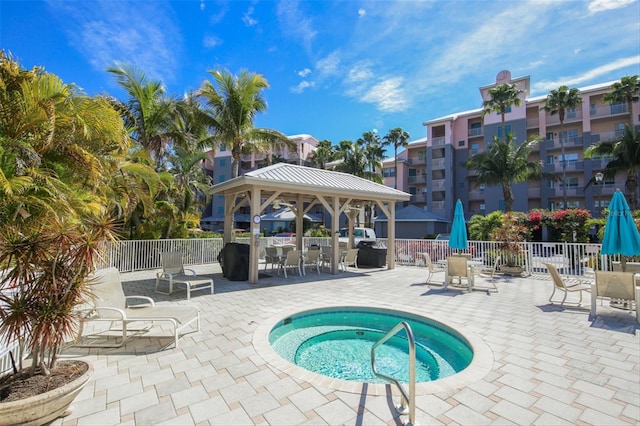 view of pool with a gazebo and a community hot tub