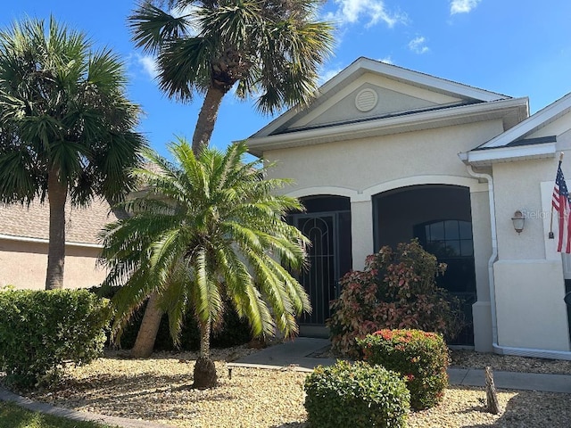 2704 Suncoast Lakes Blvd, Punta Gorda, FL 33980 - doorway to property with stucco siding