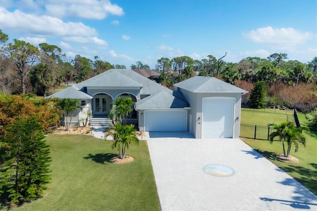 single story home featuring a front yard and a garage