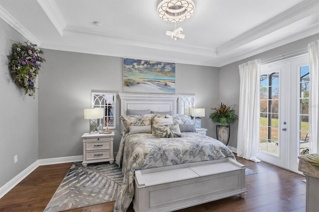 bedroom featuring crown molding, dark hardwood / wood-style floors, access to outside, and a raised ceiling