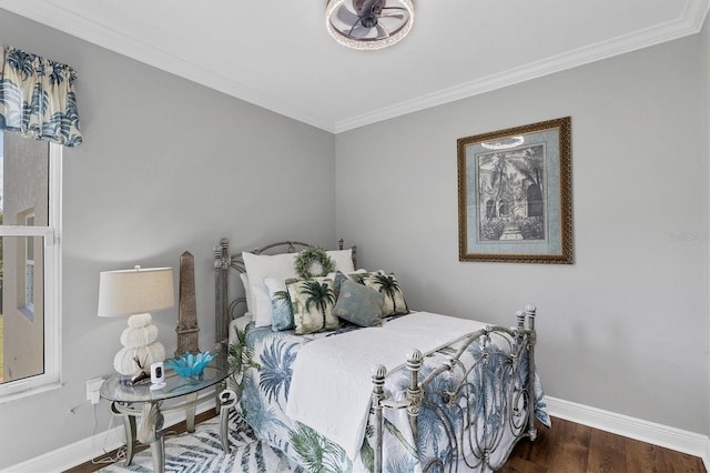 bedroom featuring ornamental molding and dark hardwood / wood-style floors