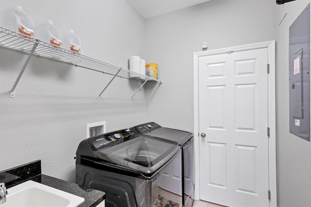 laundry area with sink and washer and clothes dryer