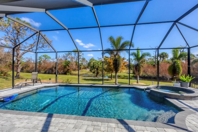 view of pool with a patio area, a lanai, an in ground hot tub, and a lawn