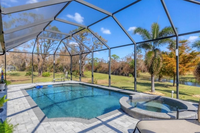 view of pool with a water view, an in ground hot tub, glass enclosure, and a lawn