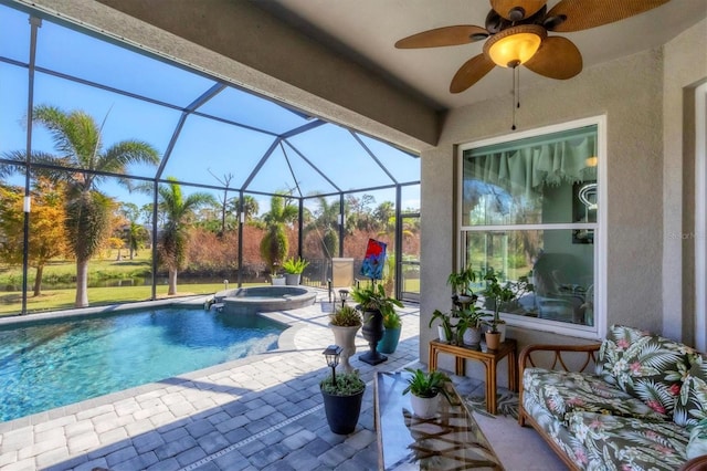 view of swimming pool with a lanai, an in ground hot tub, a patio area, and ceiling fan