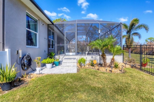 view of yard featuring a patio area and a lanai