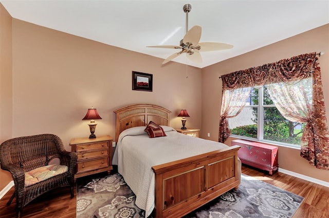 bedroom featuring hardwood / wood-style floors and ceiling fan